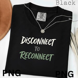 May include: Black t-shirt with the words "DISCONNECT TO RECONNECT" in white and green lettering. A silver necklace with a pendant is draped on the shirt. The shirt has a Comfort Colors tag.