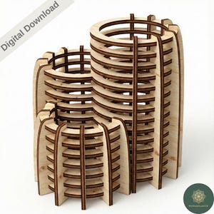 May include: Three wooden laser-cut decorative structures. The structures are cylindrical with horizontal and vertical wooden slats. The text "Digital Download" is in the upper left corner. The structures are made of light-colored wood with darker brown accents.