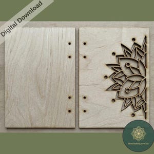 May include: Two light-colored wooden panels, one with a laser-cut floral design. The panel on the left has pre-drilled holes for binding. The words "Digital Download" are in the upper left corner.