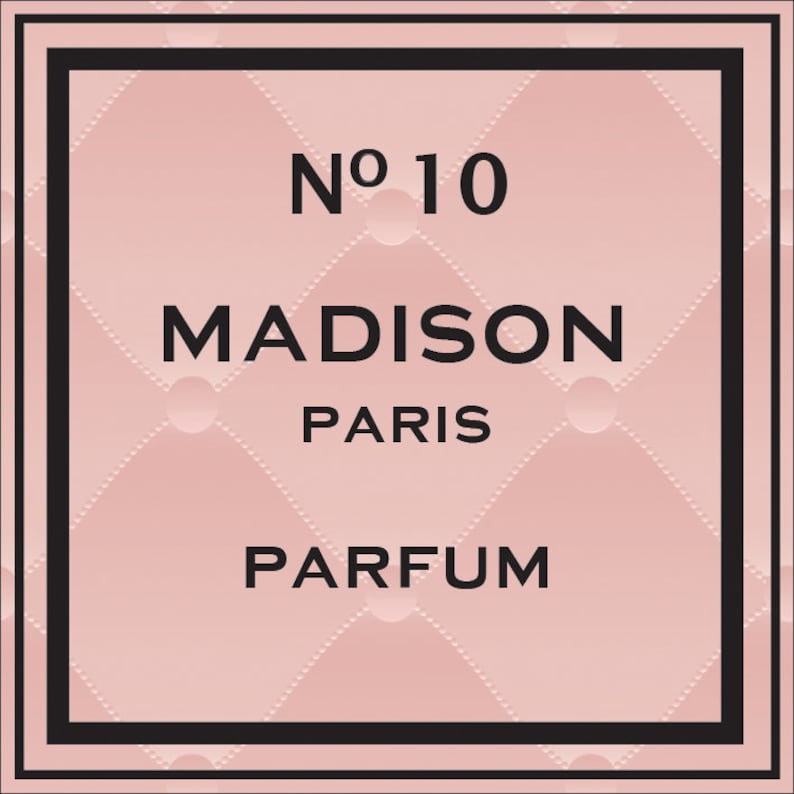 May include: A pink and black perfume bottle label with the text "No. 10 MADISON PARIS PARFUM".