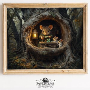 May include: A framed print featuring a whimsical scene of mice in a tree hollow. One mouse is working on a four-leaf clover, illuminated by a lantern. Two other mice observe. The artwork has a warm, inviting color palette.