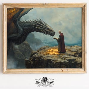 May include: A framed print depicting a fantasy scene with a dragon and a robed figure. The dragon, with dark scales and orange wings, faces a person holding a book. The background shows a rocky cliff, ocean, and cloudy sky. The print is in a wooden frame.