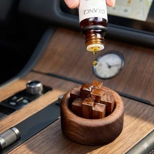 May include: A handmade, wooden cutting board with a natural finish. The board features a live edge on one side and a rectangular shape. It is approximately 18 inches long and 12 inches wide.