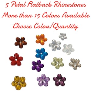 May include: A collection of colorful, five-petal flatback rhinestones in various colors, including red, orange, blue, purple, and gold. The image includes text that reads "5 Petal Flatback Rhinestones" and "More than 15 Colors Available."