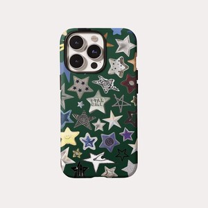 May include: A dark green smartphone case featuring a repeating pattern of various stars in different colors, textures, and styles. Some stars are solid, others are outlined, and one star contains the text STAR GIRL in a white font.