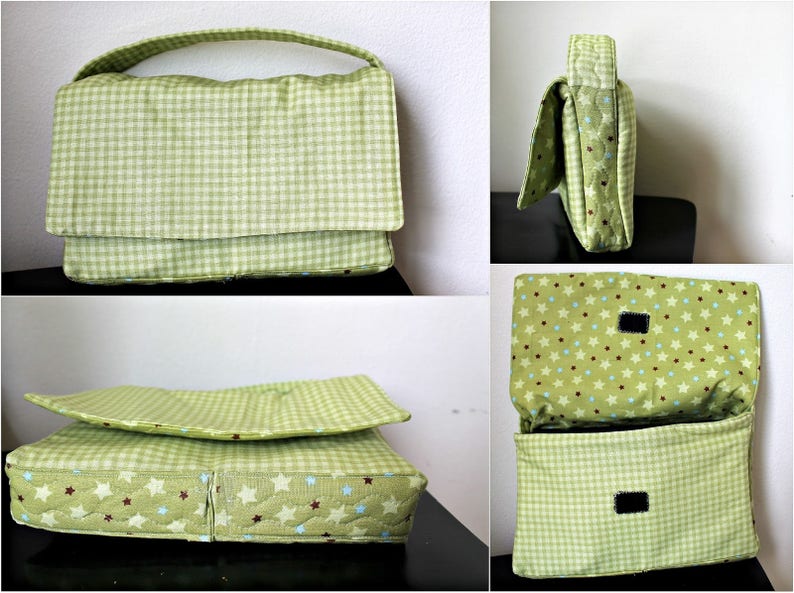 May include: A green and white gingham patterned handbag with a matching handle and flap closure. The interior lining features a star pattern with blue and brown accents. The bag is made of quilted fabric.