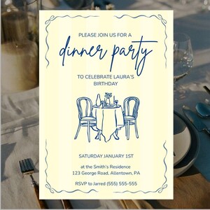 May include: Cream-colored invitation with navy blue text and illustrations. The text reads "Please join us for a dinner party to celebrate Laura's birthday." A sketch of a table set for two is featured. The date is Saturday, January 1st.