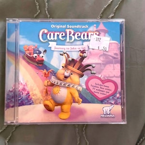 May include: A set of three ceramic mugs with a speckled, matte finish. The mugs are in shades of cream, light gray, and dark gray. Each mug has a simple, minimalist design, perfect for coffee or tea.