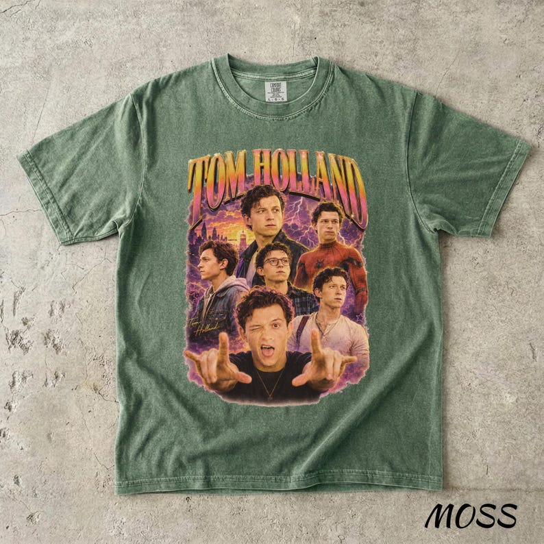 May include: Green t-shirt featuring a graphic of Tom Holland with the text "TOM HOLLAND" in a retro style. The design includes multiple images of the actor. The word "MOSS" is printed at the bottom right corner.