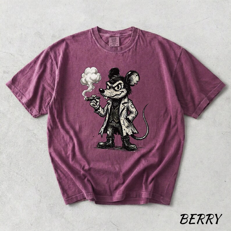 May include: Berry-colored t-shirt featuring a cartoon mouse smoking a cigar, dressed in a coat and boots. The graphic is in black and white. The word "BERRY" is printed in the bottom right corner.