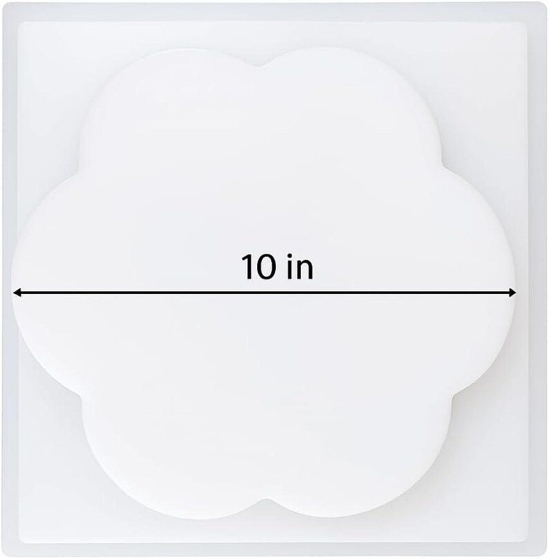 May include: A white, cloud-shaped object with a 25.4 cm measurement indicated by a black line and text. The object is set against a white background, suggesting a clean, minimalist aesthetic. The design is simple and modern.
