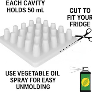 May include: A white, square mold with multiple cone-shaped cavities. Text indicates each cavity holds 50 mL. The image also shows scissors, suggesting the mold can be cut to fit a fridge, and a spray bottle for easy unmolding.