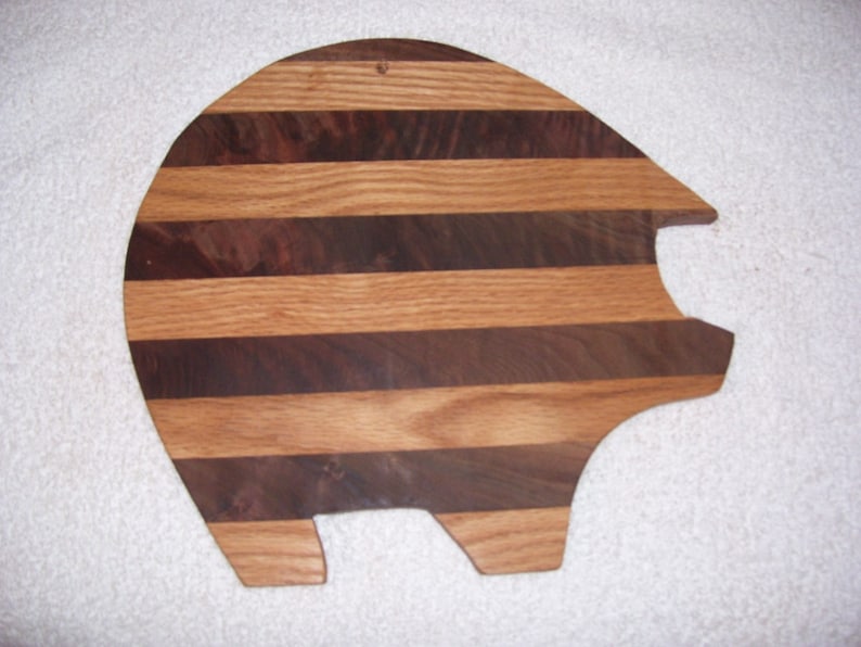 made from oak and walnut Pig cutting board