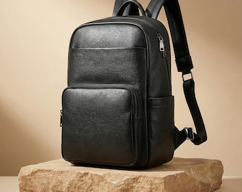 Lederen herenrugzak, strakke zwarte laptoprugzak voor werk, moderne rundlederen reistas, professionele 13,6-inch MacBook-tas
