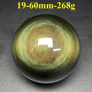 May include: A polished, spherical gemstone with a swirling pattern of gold and green hues. The text "19-60mm-268g" is visible at the top. The sphere is approximately 2.36 inches in diameter and weighs 9.45 ounces.