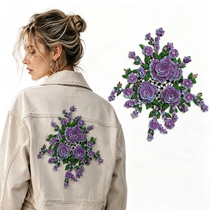 May include: A large, decorative floral applique patch featuring intricate purple flower blossoms with shimmering sequin details and vibrant green leaves, shown both as a standalone item and attached to the back of a beige denim jacket.