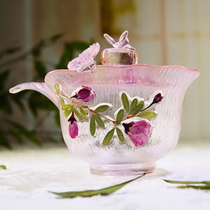 May include: A set of three ceramic mugs with a speckled, matte finish. The mugs are in shades of cream, light gray, and dark gray. Each mug has a simple, minimalist design, perfect for coffee or tea.