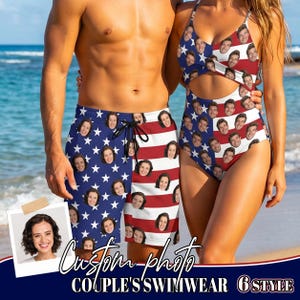 May include: A pair of swim trunks and a one-piece swimsuit featuring a custom American flag pattern with repeating printed faces. The trunks have a drawstring waist, and the swimsuit has a cutout midriff design with thin shoulder straps.