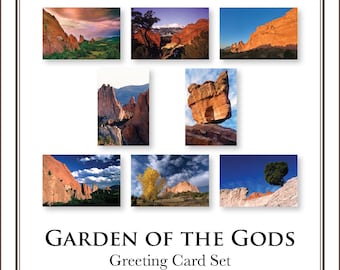 May include: A set of seven rectangular greeting cards featuring landscape photography of red rock formations, blue skies, and trees. The text GARDEN OF THE GODS Greeting Card Set is printed in black at the bottom within a thin brown border frame.