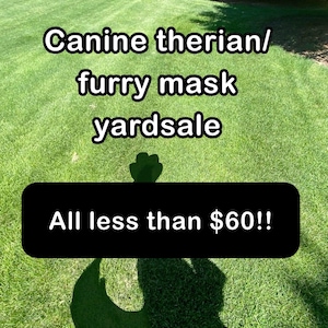 May include: Image of a yard sale on a grassy lawn. Text reads "Canine therian/ furry mask yardsale" and "All less than $60!!". The image is taken outdoors on a sunny day.
