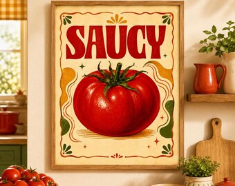 May include: A rectangular wall art print in a wooden frame featuring a large, vibrant red tomato centered on a cream-colored background. The word SAUCY is printed in bold, red, stylized capital letters above the tomato, surrounded by a decorative border.