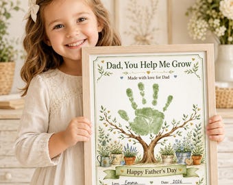May include: A framed print featuring a green handprint as the canopy of a tree, with the text "Dad, You Help Me Grow" and "Happy Father's Day". The design includes illustrations of potted plants, a watering can, and the handwritten name "Emma" and "2026".