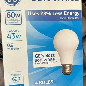 May include: A box of GE soft white light bulbs. The box is white and blue, with text indicating 60W incandescent replacement, using only 43W. The box contains 4 bulbs and has a brightness of 620 lumens.