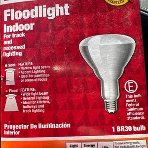 May include: Red and white ACE Floodlight Indoor box with a BR30 bulb. The box features text about the bulb's features, including spot and flood lighting options. The box also includes the text "Satisfaction ACE Promise Guaranteed."