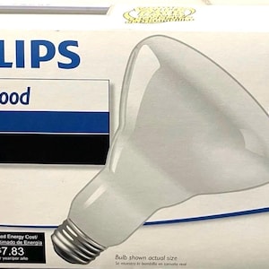 以下が含まれることがあります： Philips Indoor Flood BR30 65W電球3個入りパックの白い箱。パッケージには「Indoor Flood」、「BR30」、「65W」、「620 lumens」、「3 Medium Base BR30 bulbs」という文字が表示されています。前面には電球の大きな画像が印刷されています。