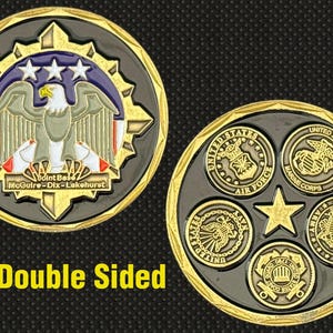 May include: Double-sided military challenge coin. One side features an eagle, stars, and text "Joint Base McGuire-Dix-Lakehurst." The other side displays emblems for the Air Force, Marine Corps, Navy, Army, and Coast Guard.