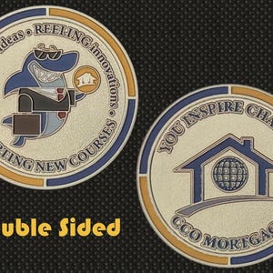 May include: Double-sided coin with a shark wearing sunglasses and a suit, holding a house icon. The coin's other side features a house icon with a globe inside. Text includes "Casting ideas", "Reeling innovations", "Charting new courses", "You inspire change", and "CCO Mortgage".