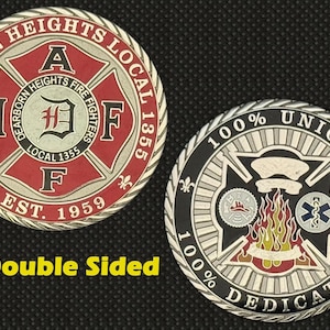 May include: Double-sided coin with the text "Dearborn Heights Fire Fighters Local 1355" and "Est. 1959" on one side, and "100% Union" and "100% Dedication" on the other. The coin is red, black, and silver in colour.