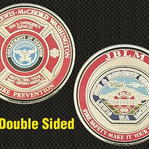 May include: Double-sided coin featuring the Joint Base Lewis-McChord Fire & Emergency Services. The coin has a red, white, and blue color scheme with text that reads "Fire Prevention" and "Fire Safety - Make it Your Priority."
