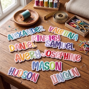 May include: A collection of embroidered fabric name patches featuring the names Alexander, Valentina, Kinsley, Samuel, Daniel, Avery, Josephine, Mason, Hudson, and Lincoln in various colorful, puffy, and rounded lettering styles.