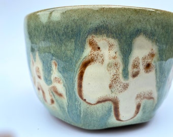 Ceramic Green bowl with off white flower and trail slip detail