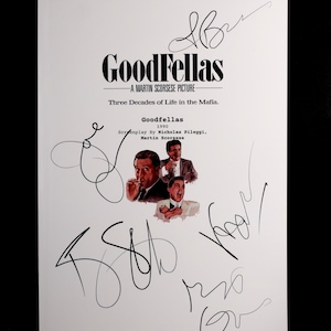 May include: A white print featuring the movie title "GoodFellas" with the text "A Martin Scorsese Picture" and "Three Decades of Life in the Mafia." The print includes images of the actors and signatures.