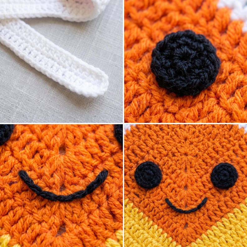 May include: A crochet item featuring orange, yellow, and white yarn. The piece includes a white strap, a black circular eye, and a black stitched smile. The texture is created with visible yarn loops, showcasing a detailed handmade construction.