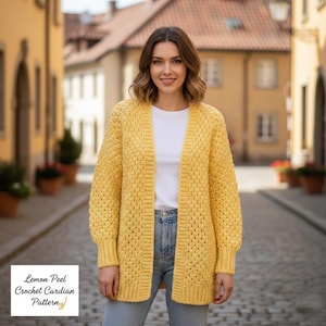 May include: A woman wearing a yellow, open-front crochet cardigan. The cardigan has a textured stitch pattern and long sleeves. The text "Lemon Peel Crochet Cardian Pattern" is in the lower left corner. The woman is wearing a white shirt and blue jeans.