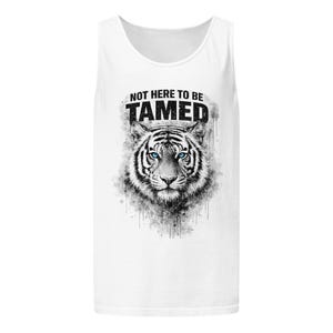 May include: White tank top featuring a black and white tiger illustration with blue eyes. The text "NOT HERE TO BE TAMED" is printed above the tiger's head in black.