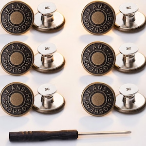 May include: A collection of bronze-colored jeans buttons with the text "JEANS HENG SHEN" around the edge. Each button has a silver-colored post and a small screwdriver is included. The buttons are arranged in a grid pattern.