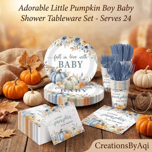 May include: A baby shower tableware set featuring plates, cups, and napkins with blue and orange pumpkin illustrations and floral accents. The text reads fall in love with BABY and A LITTLE pumpkin IS ON THE WAY. Includes blue plastic cutlery.