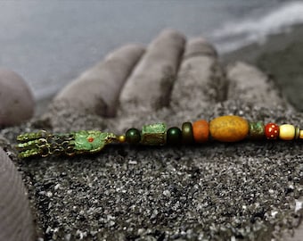 Jack Sparrow Bead Strand Yellow Bead / Kuchi Charm Pendant or Zombie Finger and Tooth Pieces of 8 or Mermaid Fertility Trinket