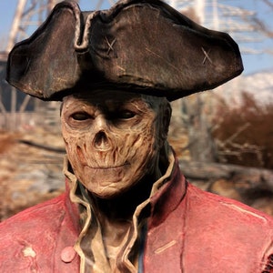 May include: A close-up of a character from the Fallout video game series. The character is wearing a red jacket and a tricorn hat. The character has a skeletal face with a sinister smile.