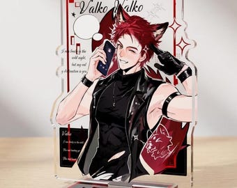 May include: A clear acrylic standee featuring an anime-style character with red hair and animal ears, wearing a black sleeveless vest and gloves. The character holds a smartphone, with text reading Valko Valko and other English phrases printed on the background.