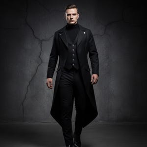May include: A black three-piece suit with a long coat. The coat has a unique cut with a longer back and a high collar. The suit includes a vest and a turtleneck shirt. The outfit is all black.