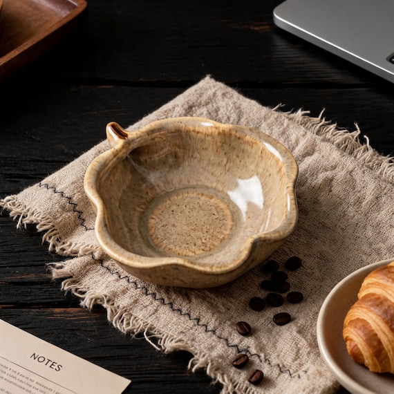 Pear-shaped ceramic with reactive glaze means no two look alike — wabi-sabi charm in a tiny functional bowl that feels like a gallery find.