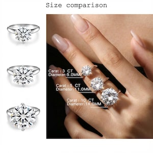 May include: Three silver-toned rings with round-cut clear stones in six-prong settings. Text labels indicate sizes: 3 CT with 9.0mm diameter, 5 CT with 11.0mm diameter, and 10 CT with 14.0mm diameter. The rings are displayed individually and on a finger.