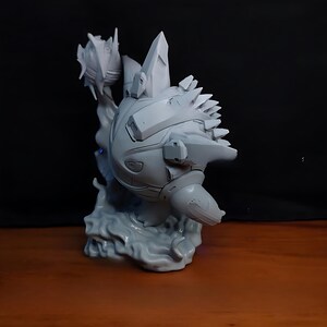 May include: A gray, 3D-printed sculpture of a futuristic creature with a spiky back and crystal-like protrusions. The sculpture is mounted on a stylized base resembling smoke or water. The overall design suggests a science fiction or fantasy theme.