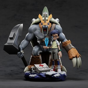 May include: A detailed figurine featuring a large, gray, muscular creature with a saber-tooth tiger mask, holding a large hammer. A smaller figure with glasses and a blue crystal stands beside it. A medical kit is at the base.