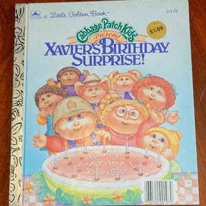 May include: A Little Golden Book titled "Cabbage Patch Kids Present Xavier's Birthday Surprise!" features a group of Cabbage Patch Kids dolls celebrating a birthday with a watermelon cake and candles. The book cover is illustrated in a colorful cartoon style.